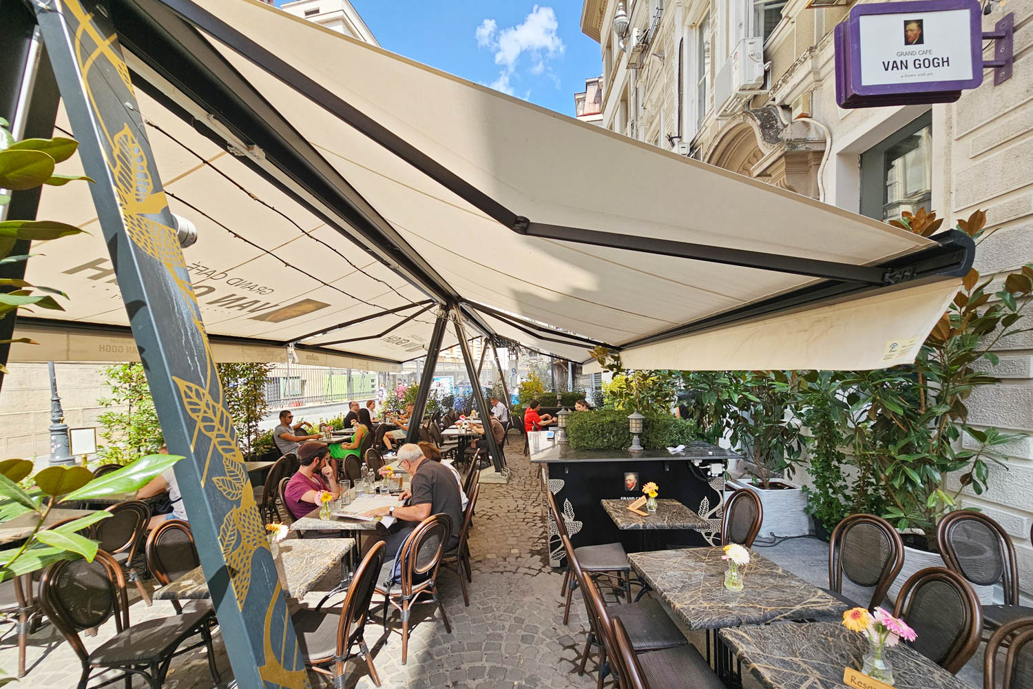 Young urban professionals in a modern coffee shop in Bucharest
